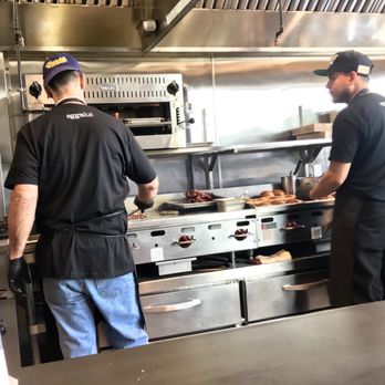 Eggslut - Making bacon and heating up the bread - Breakfast & Brunch Near Me - Los Angeles, California