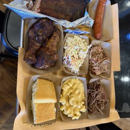 Bbq sampler: pulled pork, brisket, andouille sausage, smoked chicken legs, and ribs!! MacNcheese, coleslaw and cornbread on the side! Bbq sampler: pulled pork, brisket, andouille sausage, smoked chicken legs, and ribs!! MacNcheese, coleslaw and cornbread on the side!