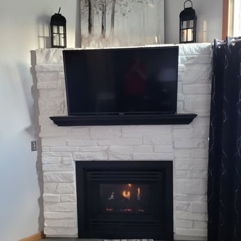 Proficient Construction - Fireplace transformation, painted brick, white, mantel and fireplace insert black and added ceramic tile hearth!! - Damage Restoration Near Me - Lake Elmo, Minnesota Proficient Construction - Fireplace transformation, painted brick, white, mantel and fireplace insert black and added ceramic tile hearth!! - Damage Restoration Near Me - Lake Elmo, Minnesota