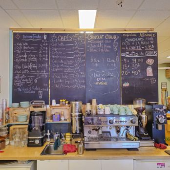 Arioum Chocolats - a coffee shop with a chalkboard - Chocolatiers & Shops Near Me - Montreal, Quebec