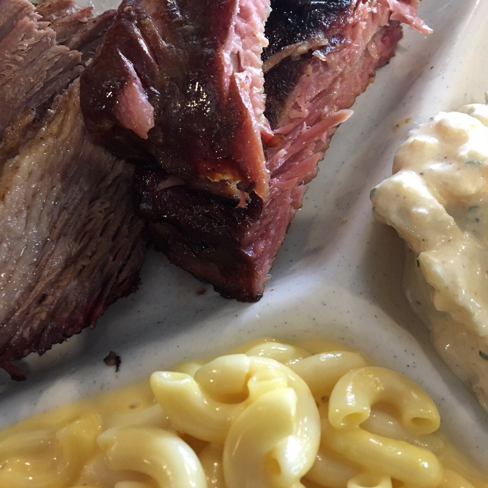Two meat platter featuring pork ribs and brisket. Two meat platter featuring pork ribs and brisket.