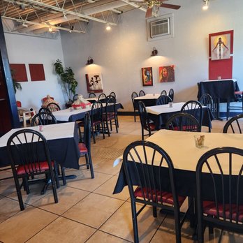 The Nile Vegan - tables and chairs in a restaurant - Ethiopian Near Me - Columbus, Ohio The Nile Vegan - tables and chairs in a restaurant - Ethiopian Near Me - Columbus, Ohio