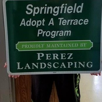 Perez Landscaping - a man standing in front of a sign - Landscaping Near Me - Springfield, Massachusetts