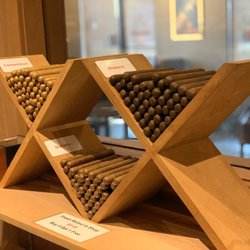 En Fuego Tobacco Shop - Fresh rolled in the shop by Rojas.