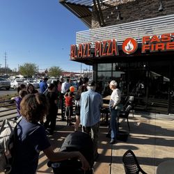 Blaze Pizza - Pi Day! The exterior with a long line.
