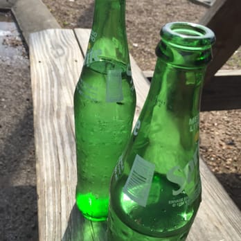 Taqueria Express - two green bottles on a picnic table - Street Vendors Near Me - Nashville, Tennessee Taqueria Express - two green bottles on a picnic table - Street Vendors Near Me - Nashville, Tennessee