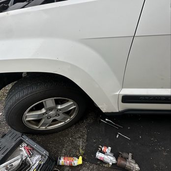 Rust Belt - starter being replaced on a 2006 jeep laredo - Auto Repair Near Me