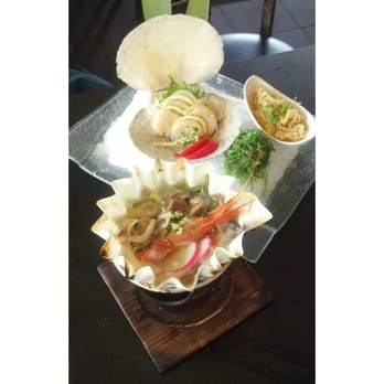 Komachi Sushi - Fresh Scallops (back) with some seafood soup (front) that is served in a paper bowl and heated with a flame on the bottom! - Japanese Near Me - Lodi, California Komachi Sushi - Fresh Scallops (back) with some seafood soup (front) that is served in a paper bowl and heated with a flame on the bottom! - Japanese Near Me - Lodi, California