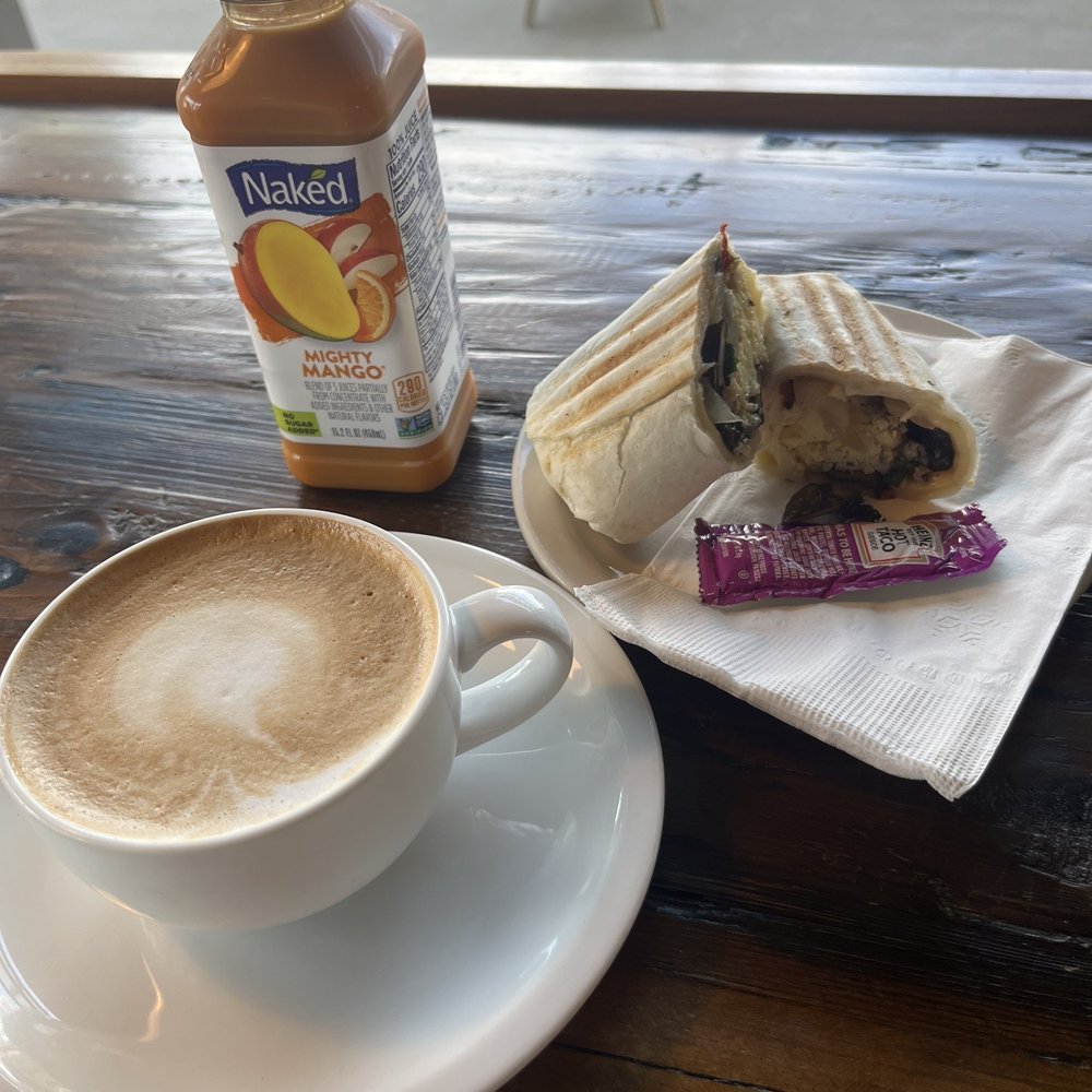 Black bear latte and vegetarian breakfast burrito with a Naked mango juice