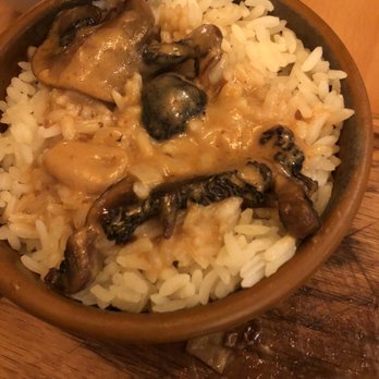 Allegro Seafood Grill - White rice, covered in gravy and mushrooms that came with my skirt steak. - Portuguese Near Me - Newark, New Jersey