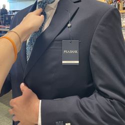 Jos A Bank - Trying on suit, tie, and dress shirt in store.