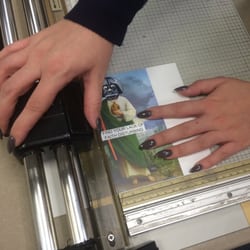 FedEx Office Print & Ship Center - Helping the gal cut up some @ShopShrineOn prints. Gotta love Star Wars. It's so cool that they have paper cutters to use here.