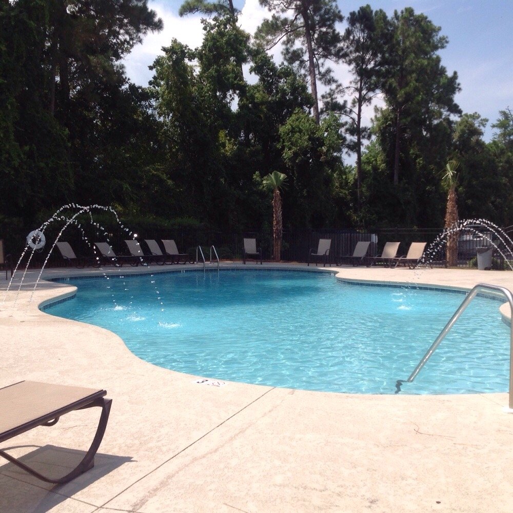 Bayview Condominiums - Bayview complex amenities include an outdoor pool that also features an outdoor restroom area - Condominiums Near Me - Orange Beach, Alabama