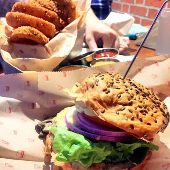 Bareburger - Astoria - County fair with rings and fries in the back - Burgers Near Me - Astoria, New York Bareburger - Astoria - County fair with rings and fries in the back - Burgers Near Me - Astoria, New York