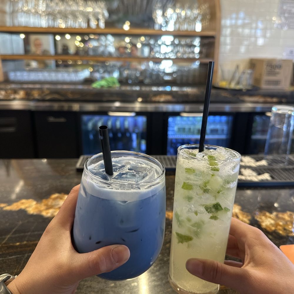 Grove Brunch Cafe - On the left blue lavender latte and on the right cucumber mint mojito - Breakfast & Brunch Near Me - El Paso, Texas Grove Brunch Cafe - On the left blue lavender latte and on the right cucumber mint mojito - Breakfast & Brunch Near Me - El Paso, Texas