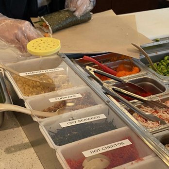 U-Maki Sushi Burrito - a woman preparing food - Japanese Near Me - Houston, Texas