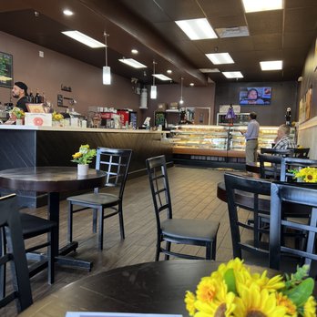 Sunny Side Up Doughnuts - Small round tables and sitting area to read, study, so work or just chill. - Donuts Near Me - Laguna Niguel, California