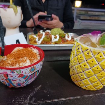 Casamigos Mexican Grill - On the left is a Mexican street corn parmesan cheese bowl on the right is that the Pina margarita - Tex-Mex Near Me - Leander, Texas Casamigos Mexican Grill - On the left is a Mexican street corn parmesan cheese bowl on the right is that the Pina margarita - Tex-Mex Near Me - Leander, Texas