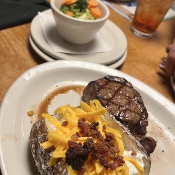 Texas Roadhouse - New York Strip* with loaded Baked Potato and Steamed Vegetables - Steakhouses Near Me - Northglenn, Colorado Texas Roadhouse - New York Strip* with loaded Baked Potato and Steamed Vegetables - Steakhouses Near Me - Northglenn, Colorado