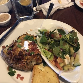 Smokey Bones - Stacked baked potato and side salad with garlic bread. - Barbeque Near Me - Greensboro, North Carolina Smokey Bones - Stacked baked potato and side salad with garlic bread. - Barbeque Near Me - Greensboro, North Carolina