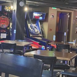 The Basement - Plenty of seating room, different arcade games around the walls