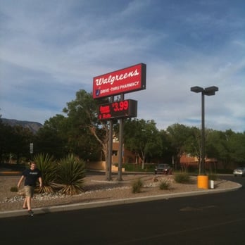 Walgreens - a man walking in front of a walgreens sign - Drugstores Near Me - Albuquerque, New Mexico Walgreens - a man walking in front of a walgreens sign - Drugstores Near Me - Albuquerque, New Mexico