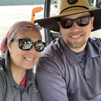 Plumas Lake Golf Club - a man and woman in a golf cart - Golf Near Me - Olivehurst, California