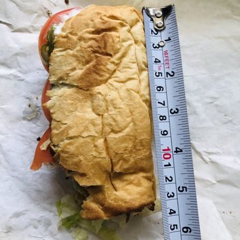 Subway - a half eaten sandwich with a measuring tape - Sandwiches Near Me - Picayune, Mississippi Subway - a half eaten sandwich with a measuring tape - Sandwiches Near Me - Picayune, Mississippi