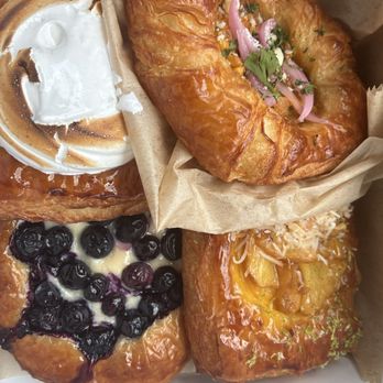 Bresnan Bread and Pastry - Top: Left: lemon-raspberry meringue danish Right: elote danish Bottom left: blueberry danish Right: pineapple/passionfruit coconut danish - Bakeries Near Me - McKinney, Texas Bresnan Bread and Pastry - Top: Left: lemon-raspberry meringue danish Right: elote danish Bottom left: blueberry danish Right: pineapple/passionfruit coconut danish - Bakeries Near Me - McKinney, Texas