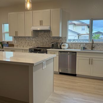 Amcor Construction - Island with wood walls, flooring - General Contractors Near Me