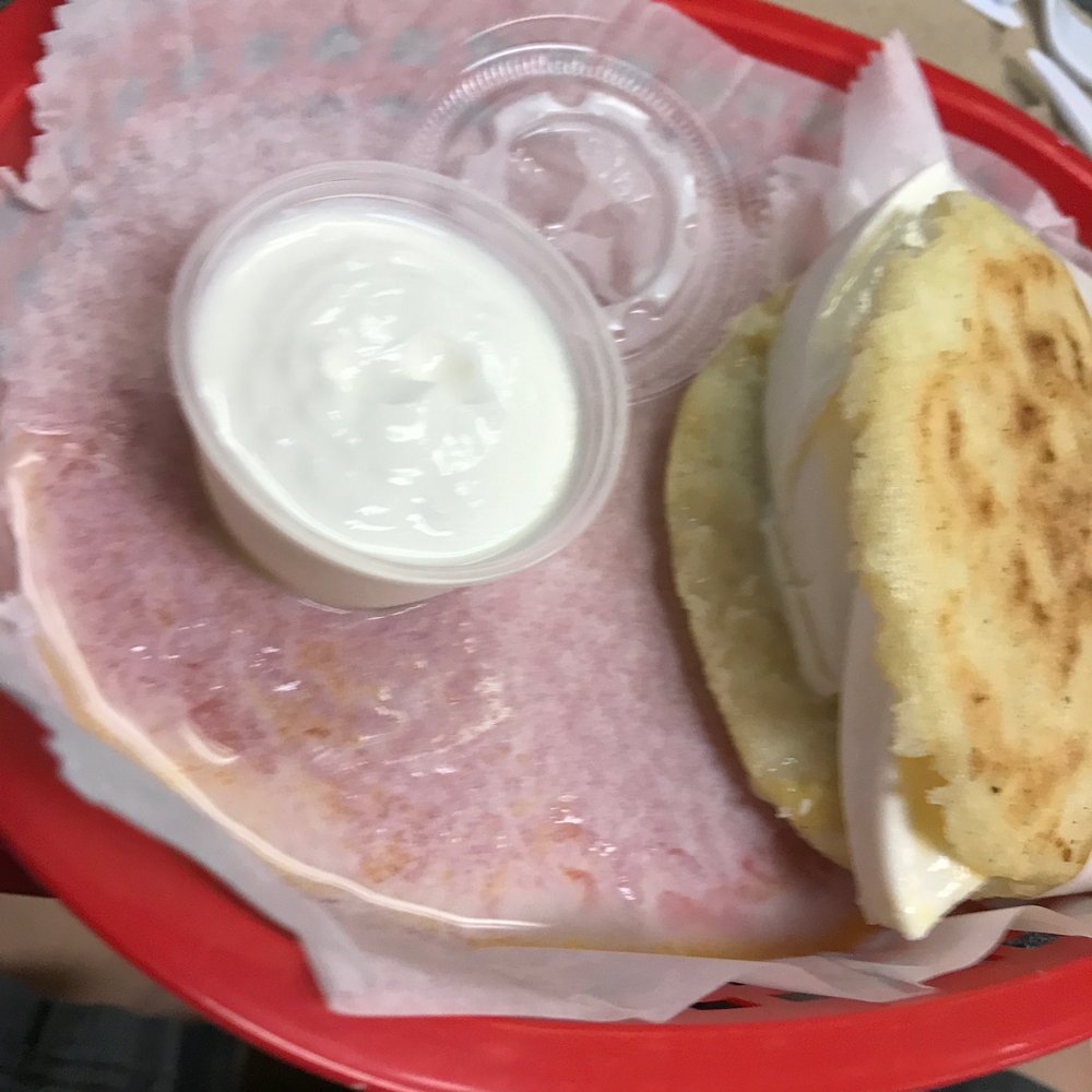 The Arepa Station - arepa with cheese and garlic sauce - Latin American Near Me - Orlando, Florida The Arepa Station - arepa with cheese and garlic sauce - Latin American Near Me - Orlando, Florida