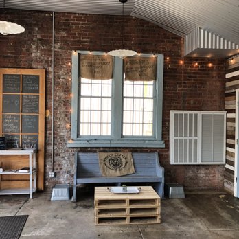 Cornerstone Coffee Company - a living room with brick walls - Coffee & Tea Near Me - Eclectic, Alabama