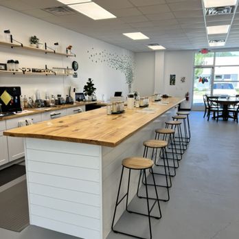 Roots - a kitchen with a counter and stools - Health Markets Near Me - Chapel Hill, North Carolina