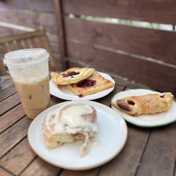 Sweet Cup Cafe - Cinnamon roll, Guava quesito, Berry and cheese danish and a Brown butter shaken espresso.
