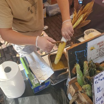 Lyall Farms Fresh Roasted Corn - Butter brushing the corn - Street Vendors Near Me - Seattle, Washington Lyall Farms Fresh Roasted Corn - Butter brushing the corn - Street Vendors Near Me - Seattle, Washington