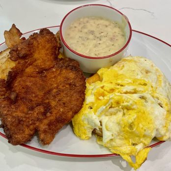 STRAT Café - Crispy chicken biscuit with gravy on the side - American Near Me - Las Vegas, Nevada STRAT Café - Crispy chicken biscuit with gravy on the side - American Near Me - Las Vegas, Nevada