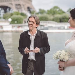 Pierre reading our ceremony in front of the Eiffel Tower
