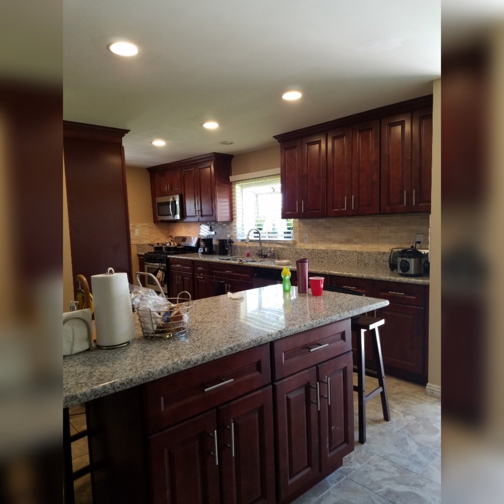 Axis Home Improvement - a kitchen with granite counter tops - Cabinetry Near Me - Van Nuys, California Axis Home Improvement - a kitchen with granite counter tops - Cabinetry Near Me - Van Nuys, California