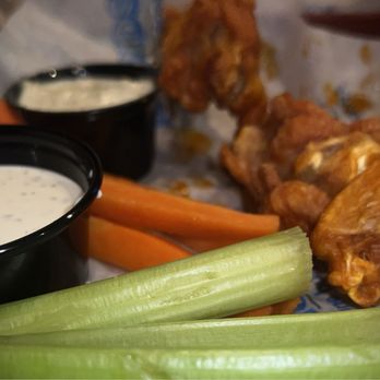 Islands Restaurant - Regular order (9 pieces) of buffalo chicken wings. - Burgers Near Me - Palm Desert, California Islands Restaurant - Regular order (9 pieces) of buffalo chicken wings. - Burgers Near Me - Palm Desert, California