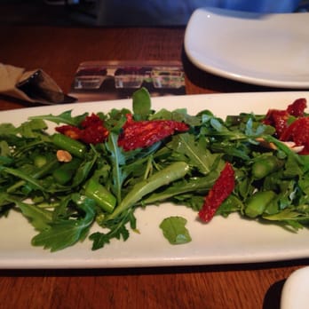 California Pizza Kitchen - Arugula asparagus with sundries tomatoes and almonds- sparse almonds and small portions - Pizza Near Me - Ann Arbor, Michigan California Pizza Kitchen - Arugula asparagus with sundries tomatoes and almonds- sparse almonds and small portions - Pizza Near Me - Ann Arbor, Michigan
