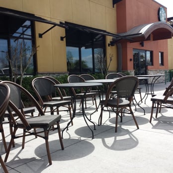 Starbucks - Outdoor seating. They also have a large umbrella. - Coffee & Tea Near Me - Odessa, Florida