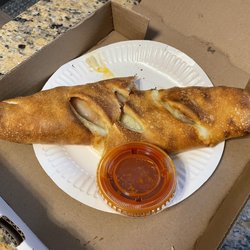 Italian Delight Pizzeria - Stromboli and marinara dipping sauce.