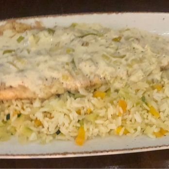 Vos Restaurante Argentino - Fish of the day with creamy leek sauce with pilaf rice - Argentine Near Me - toronto, Ontario Vos Restaurante Argentino - Fish of the day with creamy leek sauce with pilaf rice - Argentine Near Me - toronto, Ontario