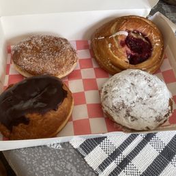 Assortment of donuts and cherry danish