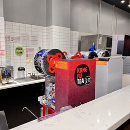 Robot shakers in the back, lid sealing machines in the front. Robot shakers in the back, lid sealing machines in the front.