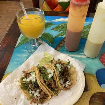 The Famous Taco - Carnitas tacos with a mango margarita. - Tacos Near Me - Fort Wayne, Indiana The Famous Taco - Carnitas tacos with a mango margarita. - Tacos Near Me - Fort Wayne, Indiana