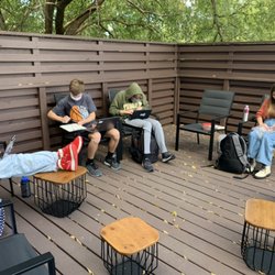 Studio Preparatory - High school students studying and collaborating with a large helping of socializing.
