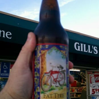 Gill's Foodmart - a hand holding a bottle of beer - Grocery Near Me - Arroyo Grande, California Gill's Foodmart - a hand holding a bottle of beer - Grocery Near Me - Arroyo Grande, California