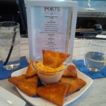 Poets Modern Cocktails and Eats - Poets in the Hotel Indigo. The signature Crab Dip with house Pinot Grigio. - New American Near Me - Baltimore, Maryland Poets Modern Cocktails and Eats - Poets in the Hotel Indigo. The signature Crab Dip with house Pinot Grigio. - New American Near Me - Baltimore, Maryland