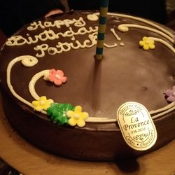 La Provence Bakery - Finished Cake with a candle added.